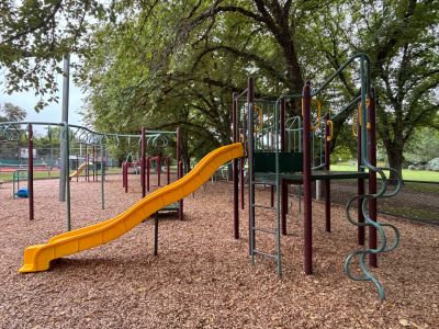 View of Ardrie park playground equipment with slide