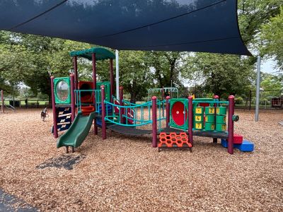 View of Ardrie park playground equipment with shade sail